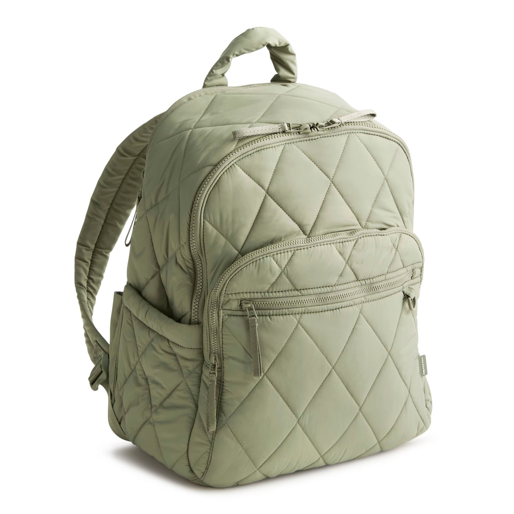 Green quilted backpack on a white background
