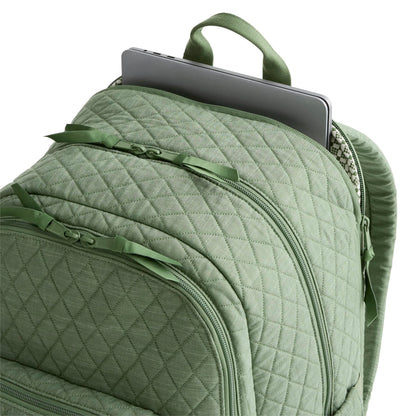 Green quilted backpack with a laptop compartment on a white background
